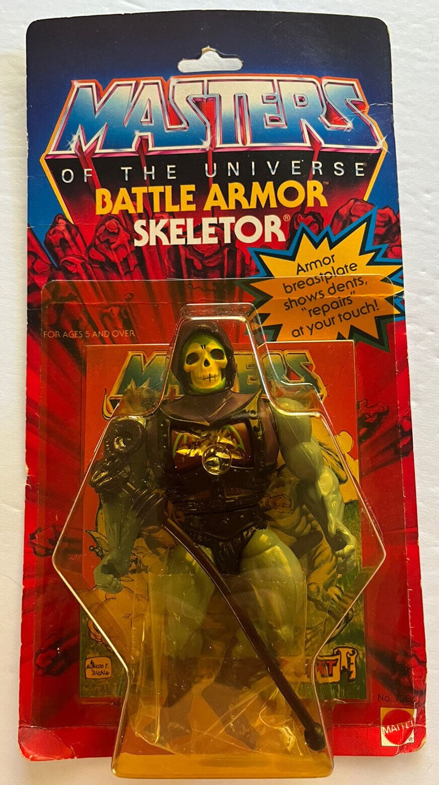 Mattel Masters of the Universe Battle Armor Skeletor with yellowed blister and failing leg bands